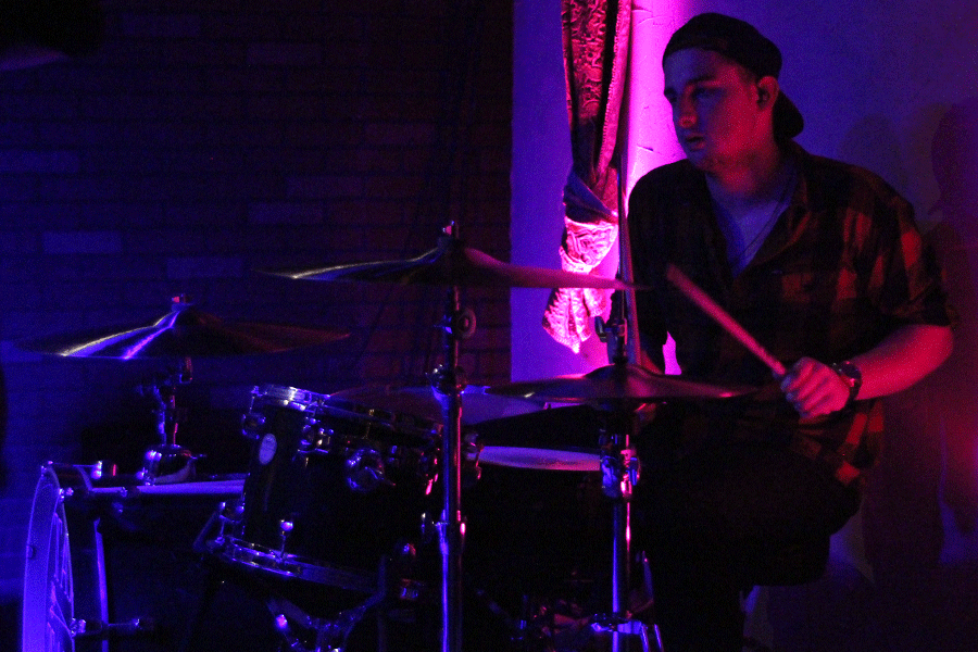 Hosler prepares to hit a cymbal.