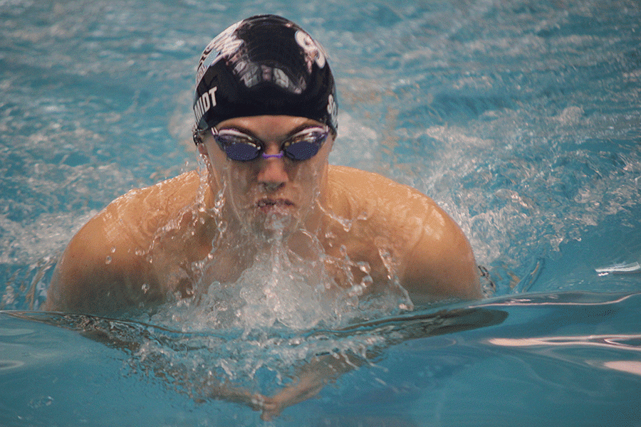 Coming up for air, senior Logan Schmidt participates in the 200 yard medley relay. 