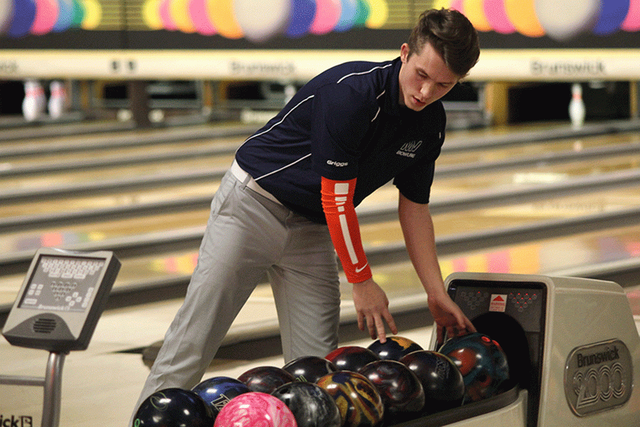 Before+he+bowls+his+next+frame%2C+senior+Cole+Griggs+prepares+to+pick+up+his+bowling+ball+at+Olathe+Lanes+East+on+Wednesday%2C+Jan.+20.+The+boys+and+girls+bowling+teams+placed+fourth+out+of+four+schools+at+the+meet+hosted+by+Olathe+East+High+School.