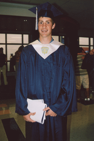 After his high school graduation, 2006 graduate Grant Treaster smiles for the camera.
