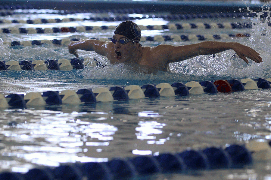 Junior Garrison Fangman places third in the 100 yard butterfly, with a time of 54.08 seconds.