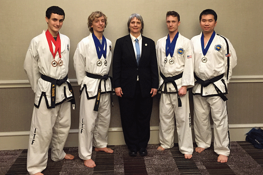 Along with his teammates, sophomore Carter Lawson (second from left) shows off his national championship medals. (Photo submitted by Carter Lawson)