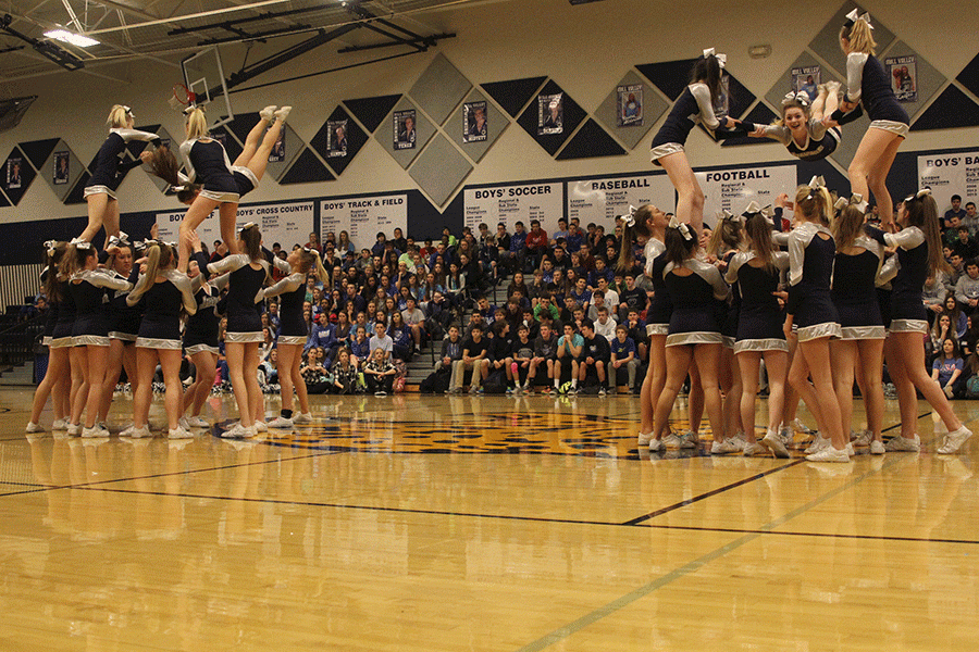 The MVHS cheer team generate excitement during the Winter Homecoming pep assembly.