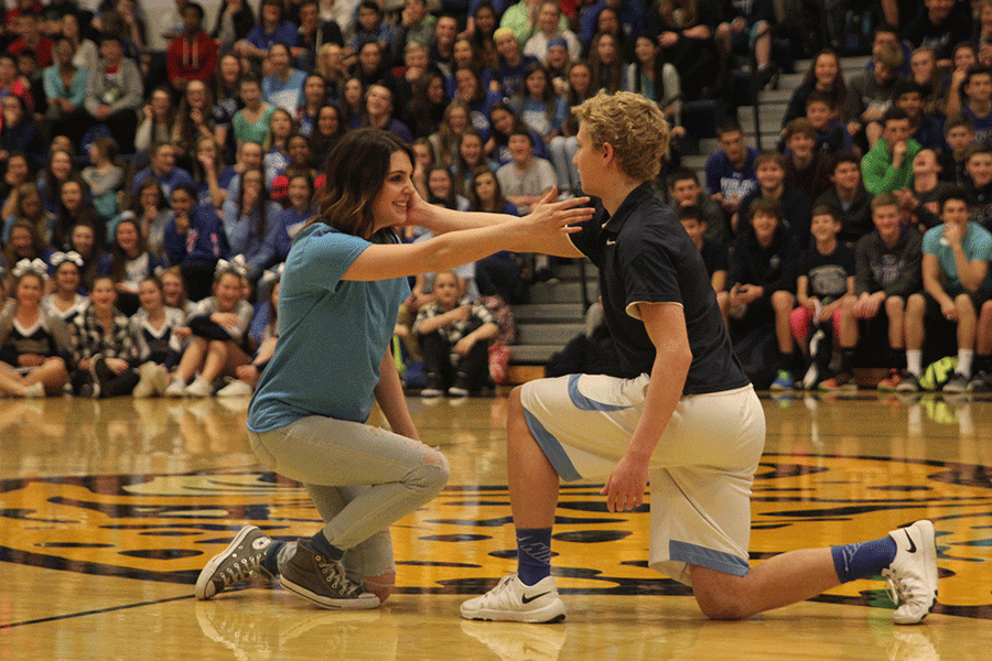 Sophomores Maggie Lane, Dante Peterson and Cooper Kaifes (not shown) entertain the student body with their dynamic dance routine at the Winter Homecoming pep assembly.