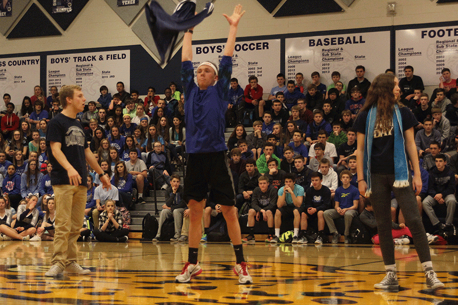 Seniors Jeremiah Kemper, Merrick Vinkie and Dalton Sieperda compete on behalf of the senior class in a dance-off during the Winter Homecoming pep assembly.