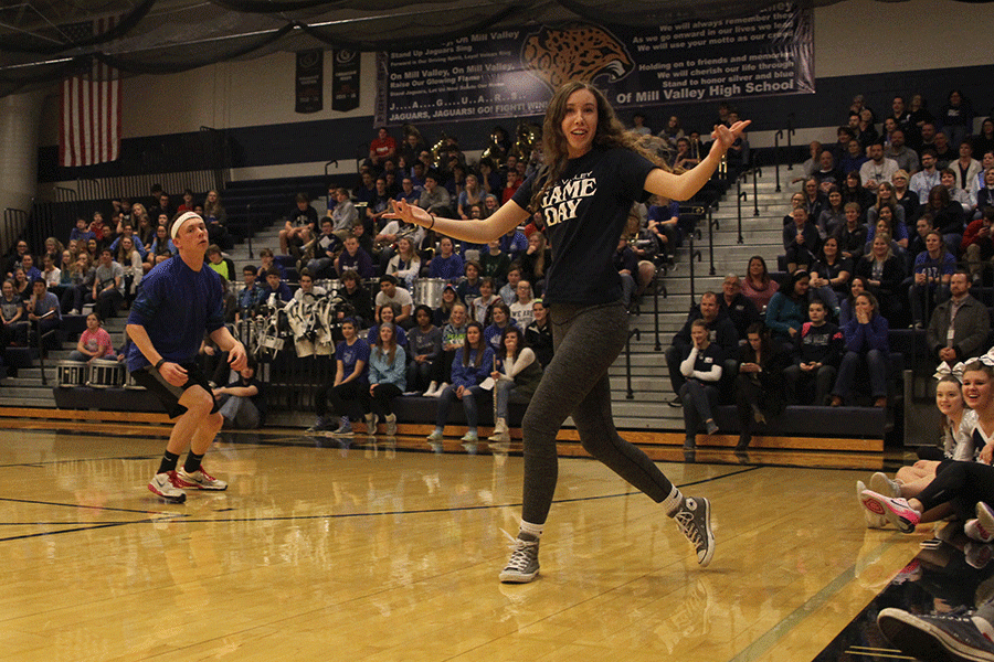 Seniors Jeremiah Kemper, Merrick Vinkie and Dalton Sieperda (not shown) compete on behalf of the senior class in a dance-off during the Winter Homecoming pep assembly.