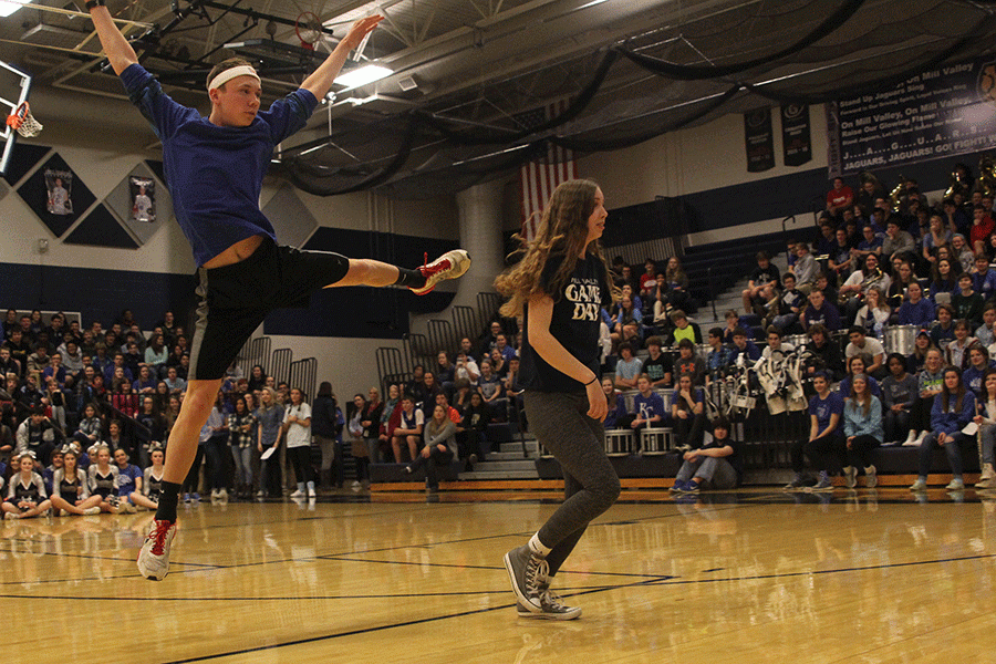 Seniors Jeremiah Kemper, Merrick Vinkie and Dalton Sieperda (not shown) compete on behalf of the senior class in a dance-off during the Winter Homecoming pep assembly.