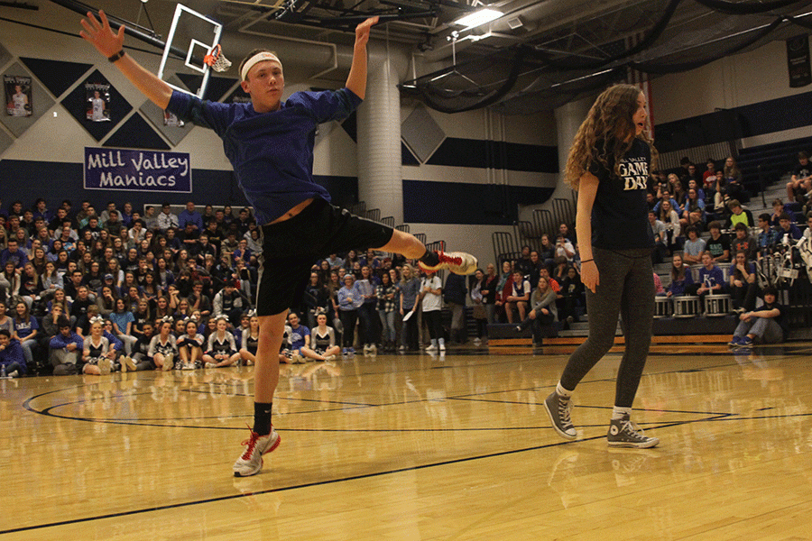 Seniors Jeremiah Kemper, Merrick Vinkie and Dalton Sieperda (not shown) compete on behalf of the senior class in a dance-off during the Winter Homecoming pep assembly.