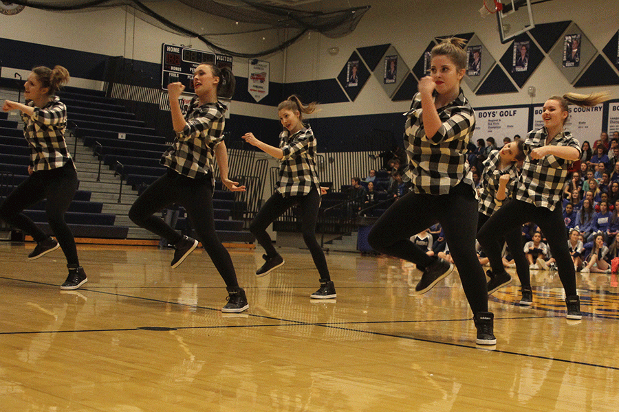 The Silver Stars dance team performs a routine at the Winter Homecoming pep assembly.