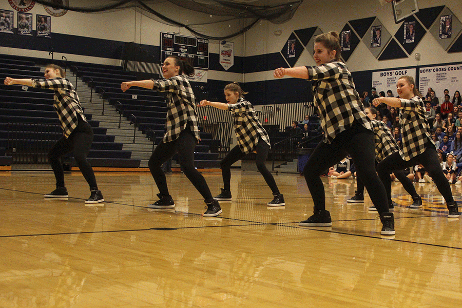 The Silver Stars dance team performs a routine at the Winter Homecoming pep assembly.