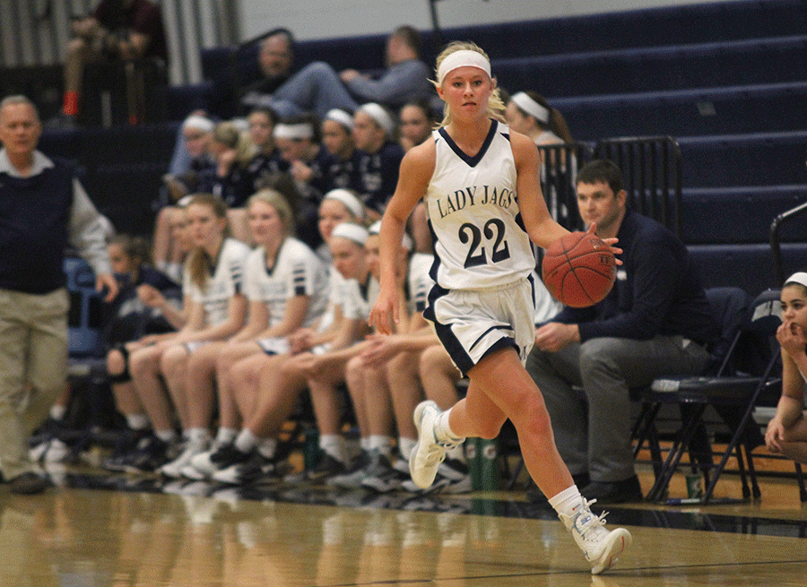 Junior Courtney Carlson runs down the court towards the basket on Friday, Feb. 12. The Lady Jags beat Turner 57-27.