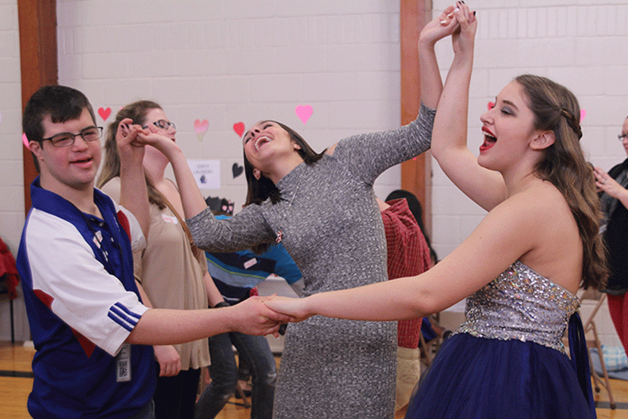 Senior Maddie Gerber dances with sophomore Emily Wagner.