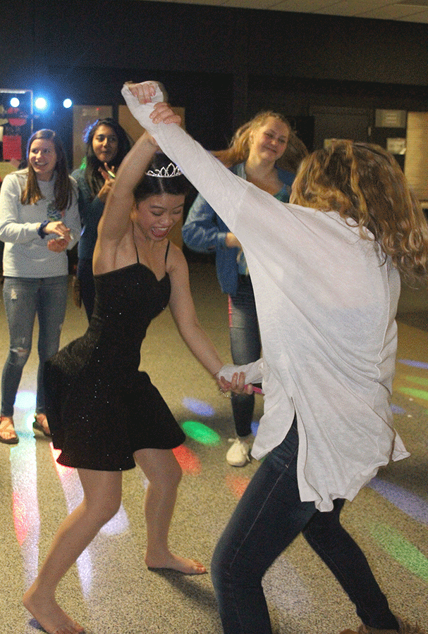 Senior Camille Gatapia dances with sophomore Dani Crispin.