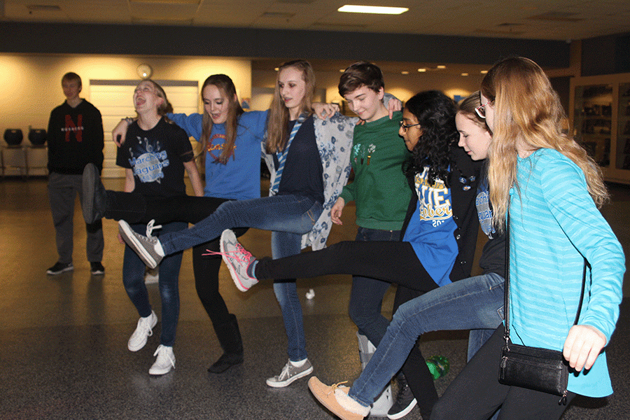 Following the boys basketball game on Friday, Feb. 5, students perform the Can Can line during the winter homecoming dance.