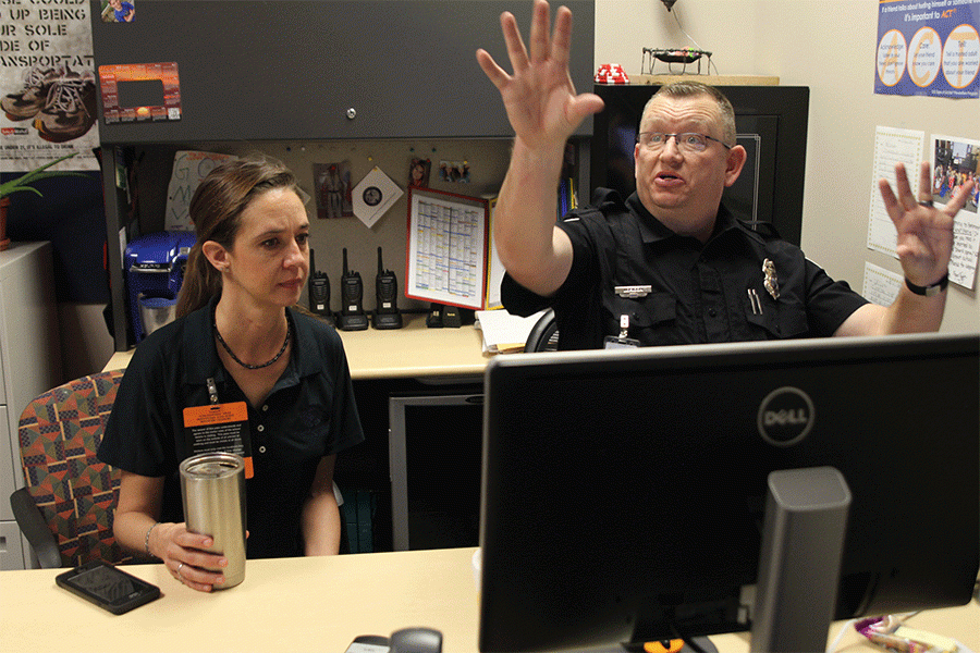 School resource officer Mo Loridon talks with Mayor Michelle Distler during her visit to the school on Friday, Feb. 19.