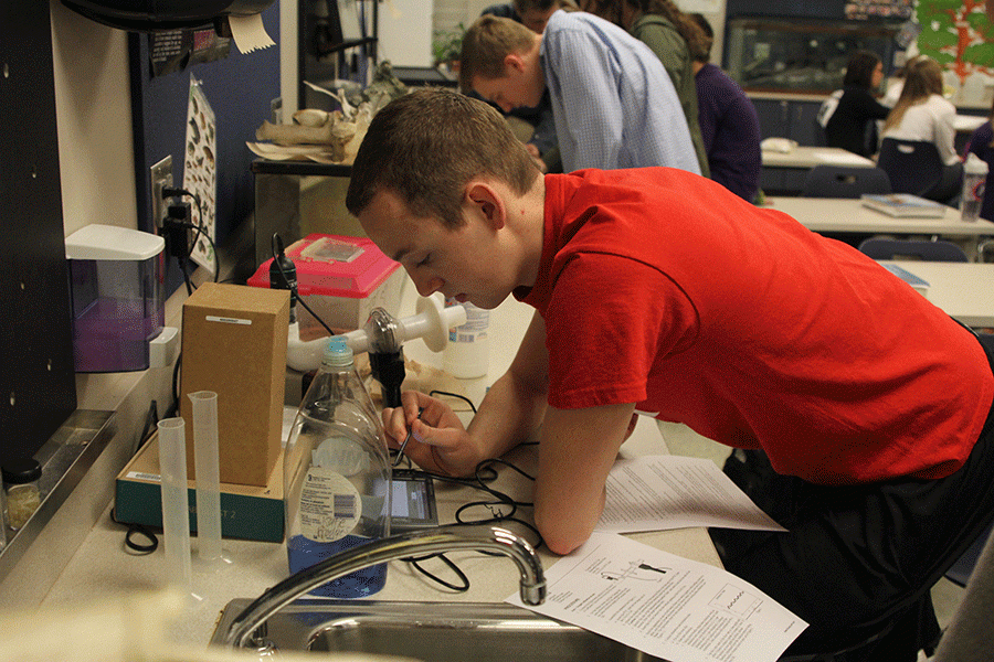 After collecting data from the oxygen and aerobic metabolism lab, senior Logan Schmidt enters his findings on the Labquest on Wednesday, Feb 24.