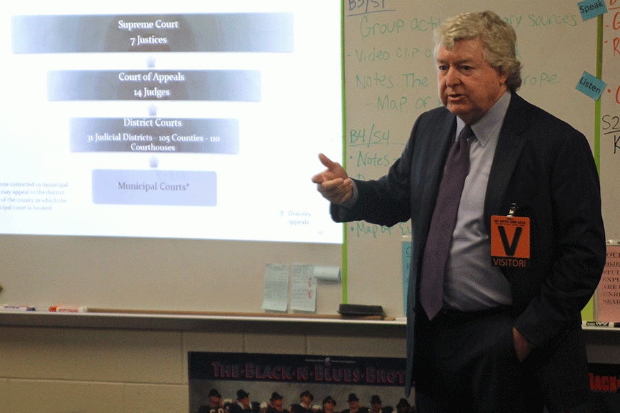 To help students learn about the state judicial branch, state Supreme Court Justice Dan Biles speaks to social studies teacher Angie DalBello's Constitutional Law class Wednesday, March 30.