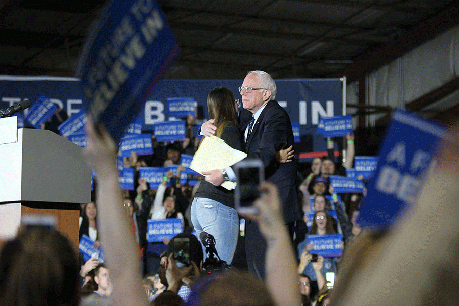 Weber and Sanders greet each other as Sanders takes the stage on Thursday, March 3. 