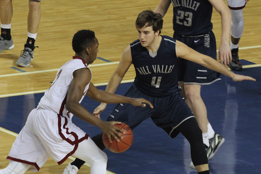 Keeping a close eye on the ball, senior Logan Koch plays defense. 