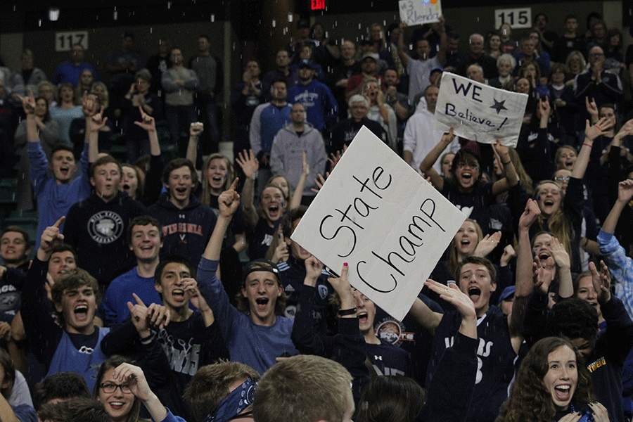 The student section celebrates a state championship win.