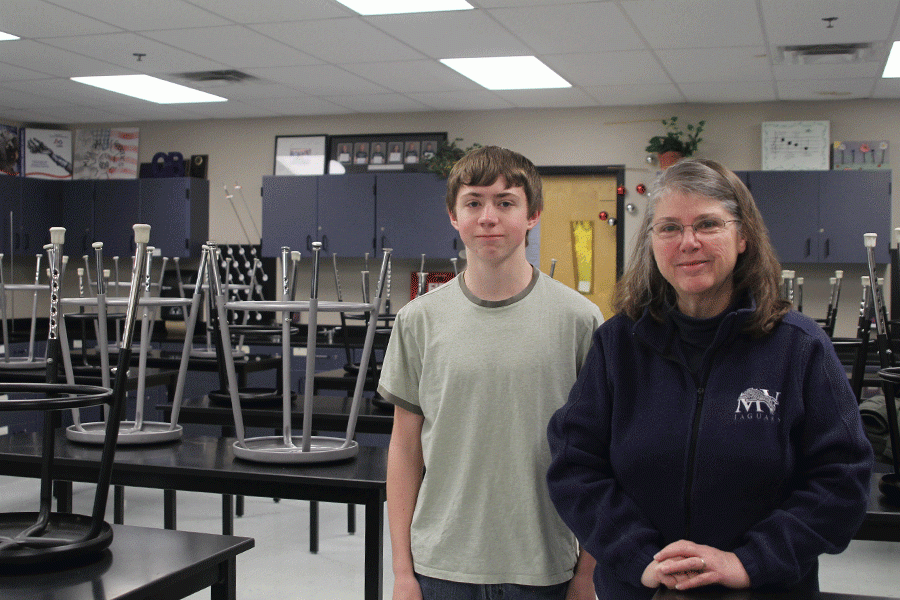 Sophomore Jameson Isaacsen stands with Quiz Bowl coach Mary Beth Mattingly in her classroom. 