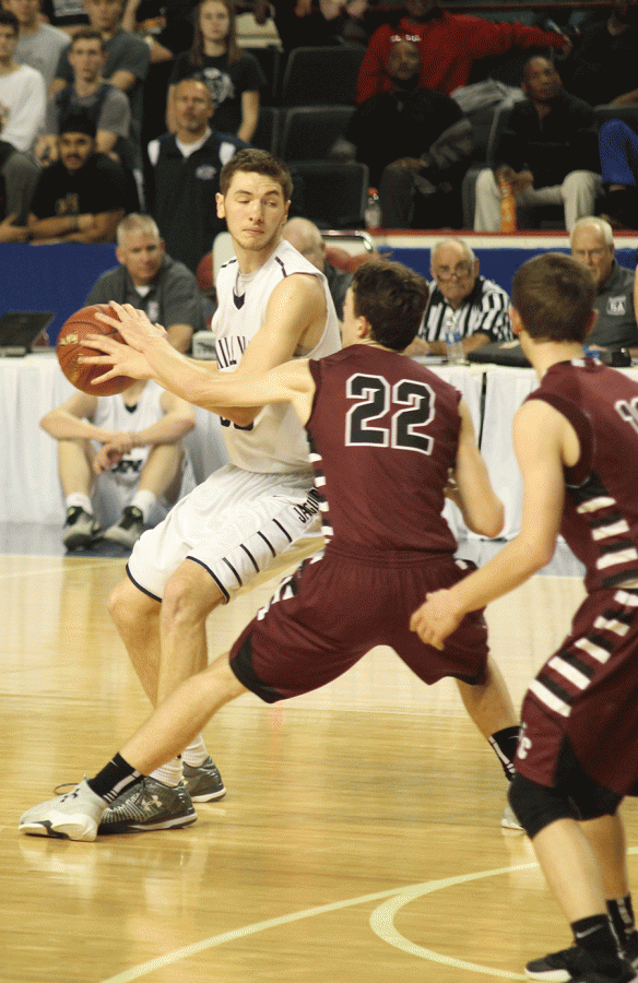 Senior center Clayton Holmberg keeps the ball from opponents.