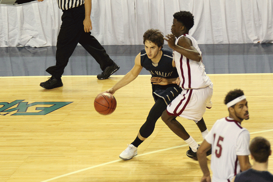 Senior Logan Koch dribbles around his opponent.