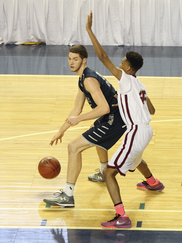 Senior Clayton Holmberg protects the ball.