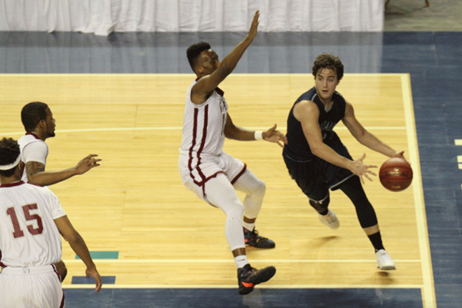 Senior Logan Koch saves the ball from going out of bounce.