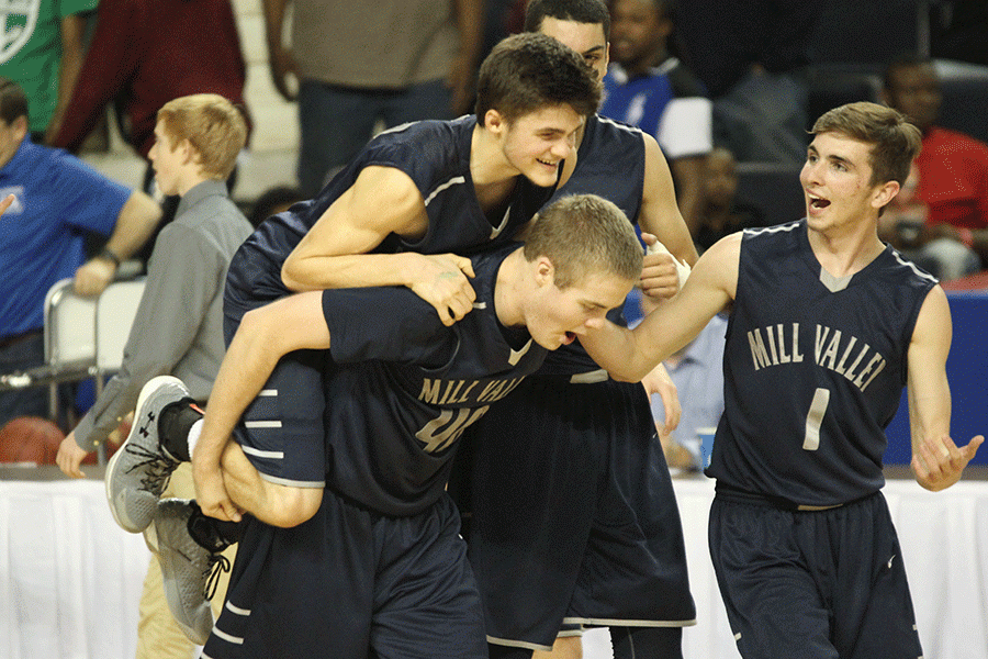 At the end of the game senior Kasey Conklin jumps on senior Tyler Grauers back.