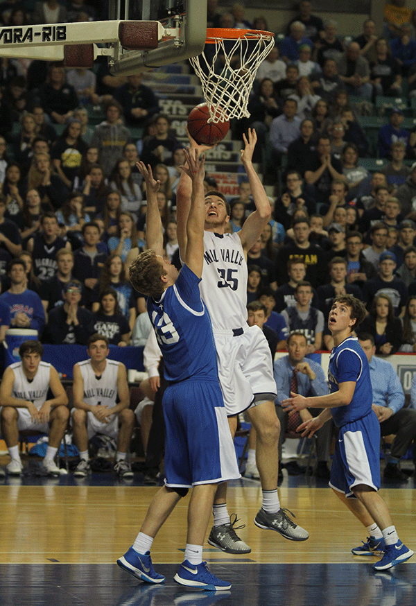 Senior Clayton Holmberg shoots a basket.