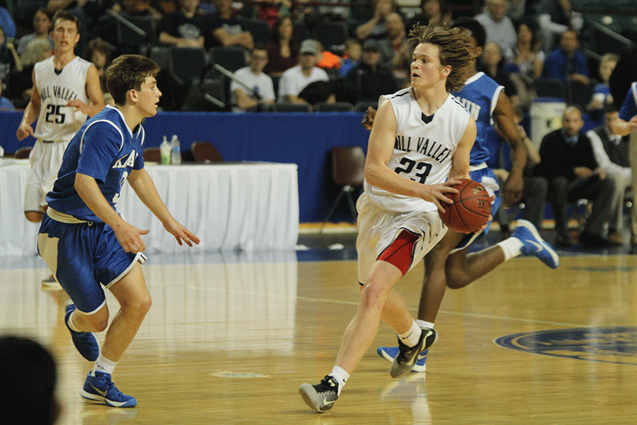 Sophomore Cooper Kaifes dribbles the ball down the court.