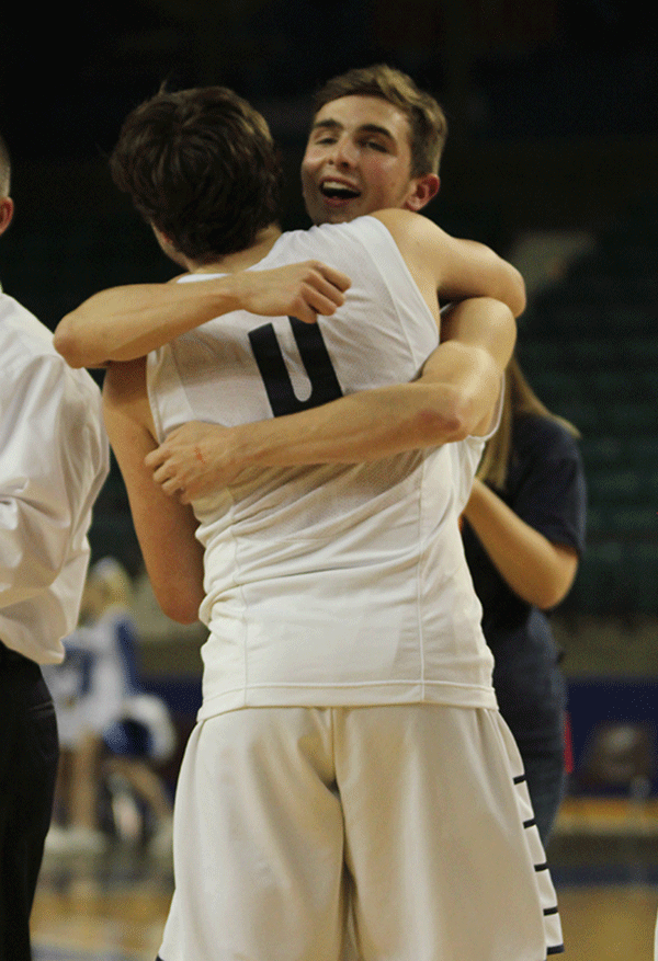 Senior Ethan Lane hugs senior Logan Koch.