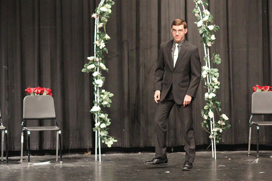Junior Tom McClain walks across the stage.