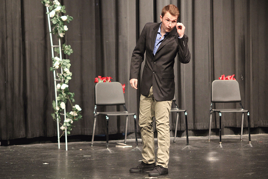 Junior Austin Garner poses with his glasses.