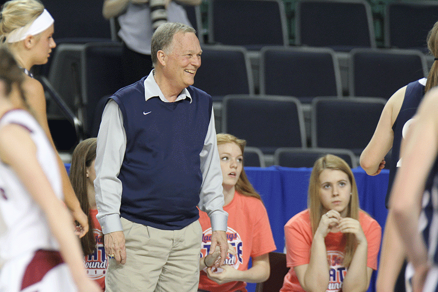 During the last moments of her last basketball game, McFall flashes senior Catie Kaifes a smile.