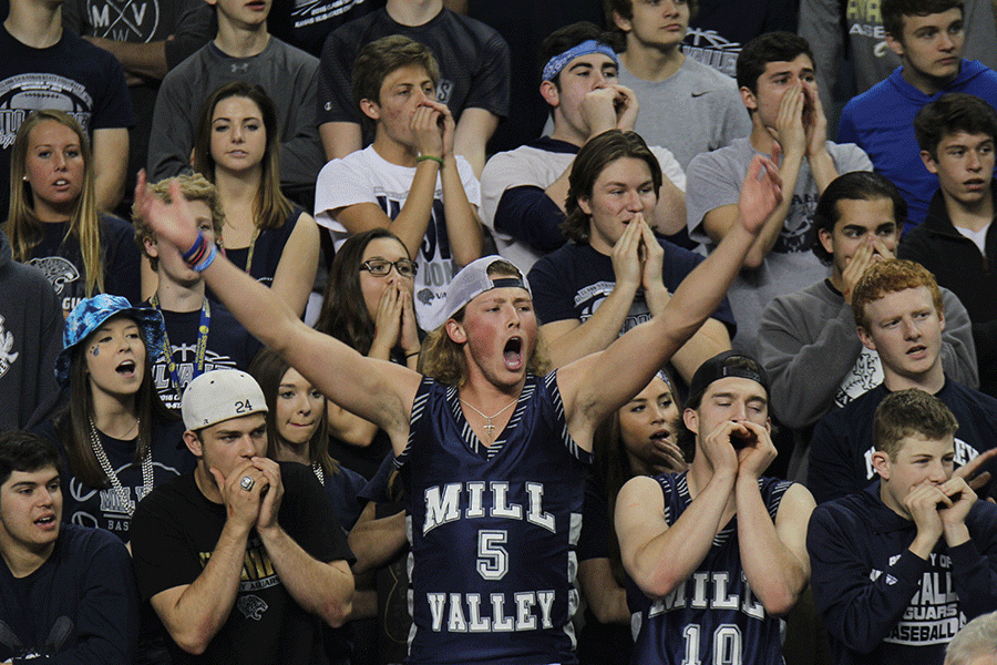 Senior Lucas Krull and the student section yell as Salina makes a free throw.