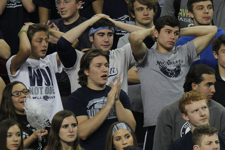 The student sections anticipates a free throw.