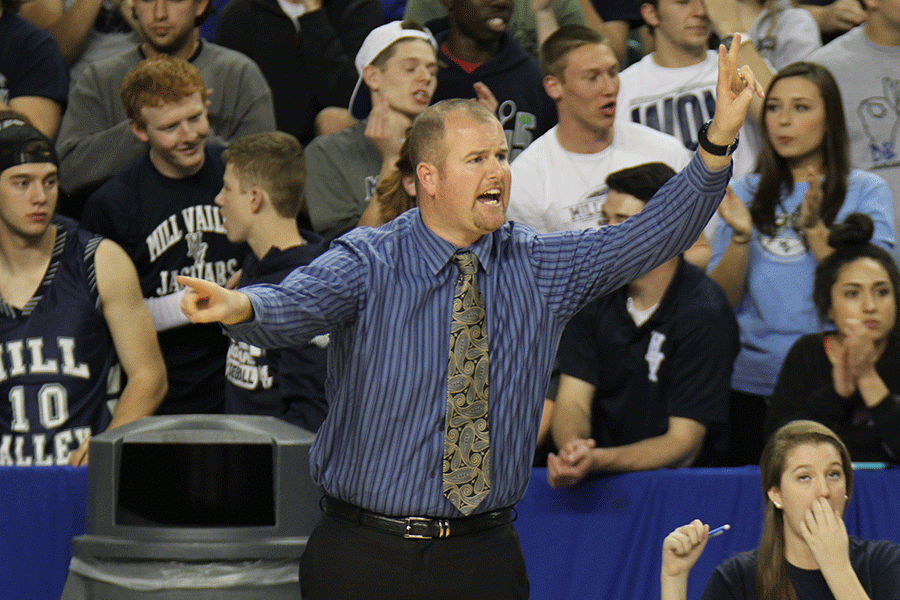 Coach TJ Finan coaches his players during the game.