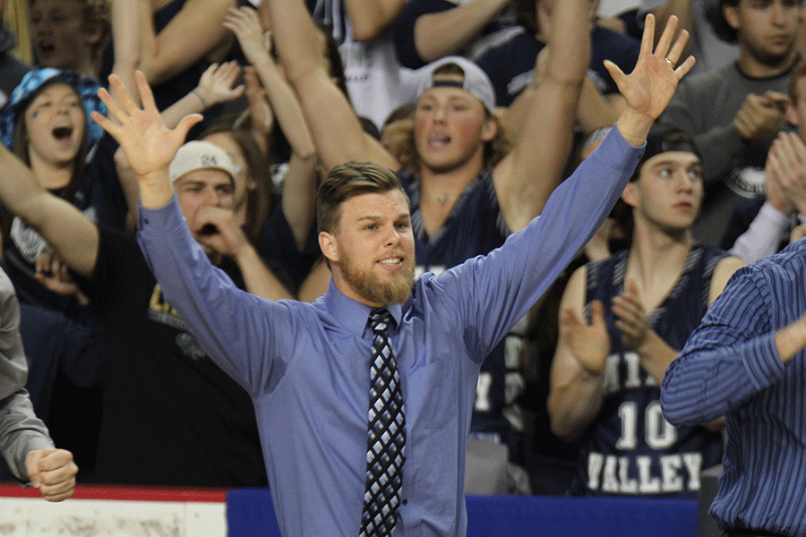 Coach Zach McFall coaches from the bench.