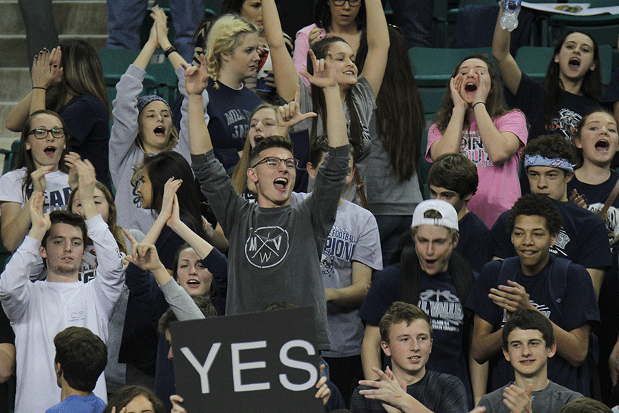 Junior Sam Lopez cheers as the Jags clinches the win against Salina.