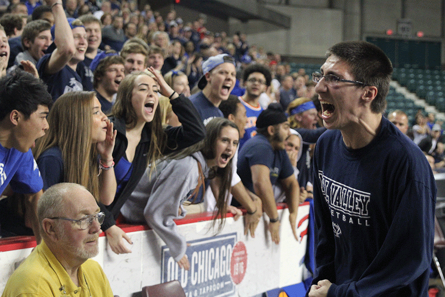 Manager James Bock encourages the crowd to cheer on the Jaguars.