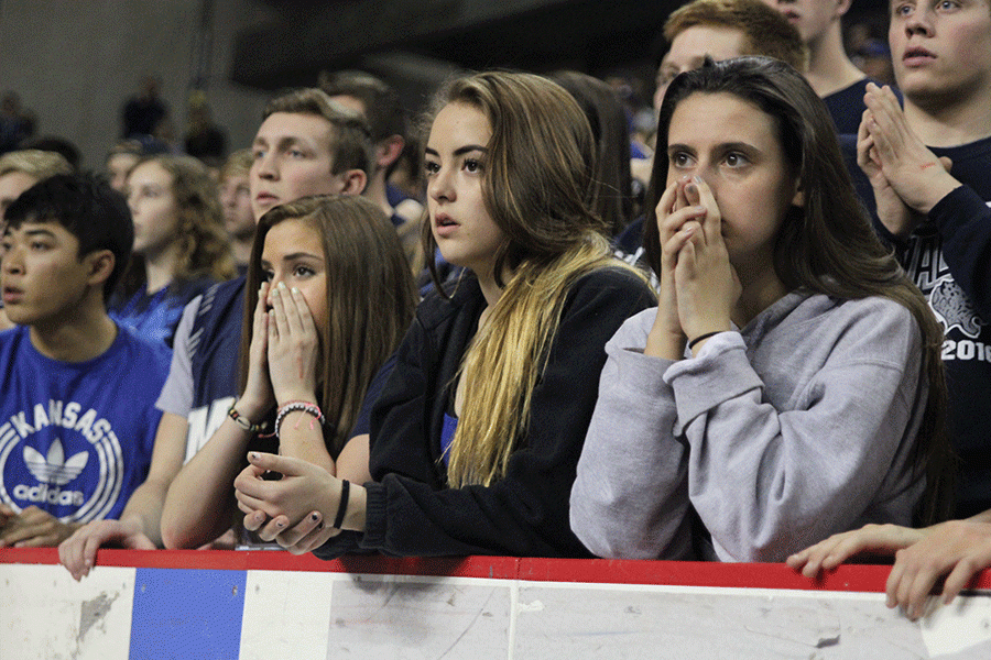 The crowd holds their breath as the game goes into overtime.