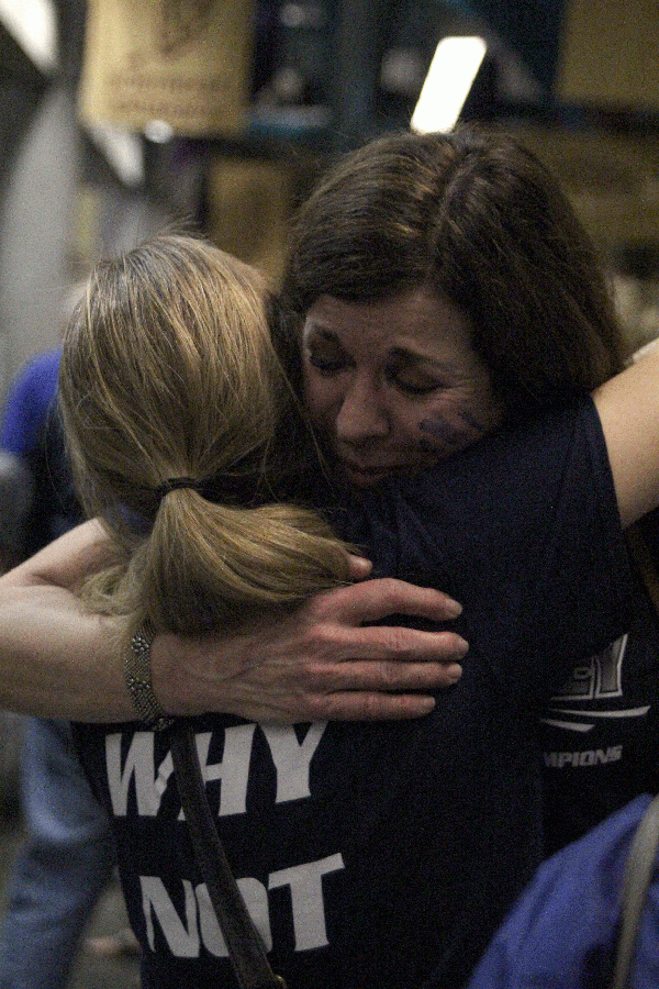 Moms hug after the Jaguar win.