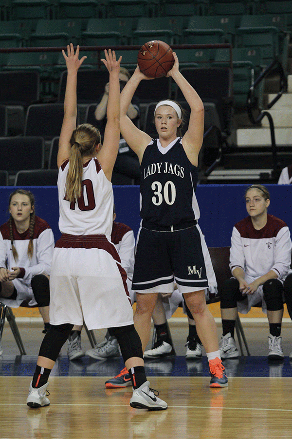 Senior Catie Kaifes looks at her teammates to find where to pass the ball. 