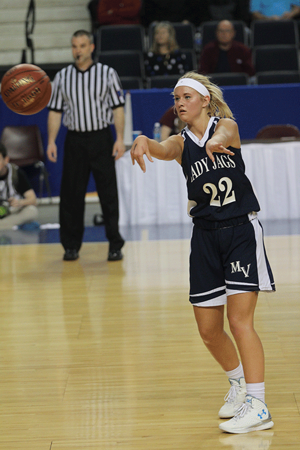 Junior Courtney Carlson passes the ball to her teammate.