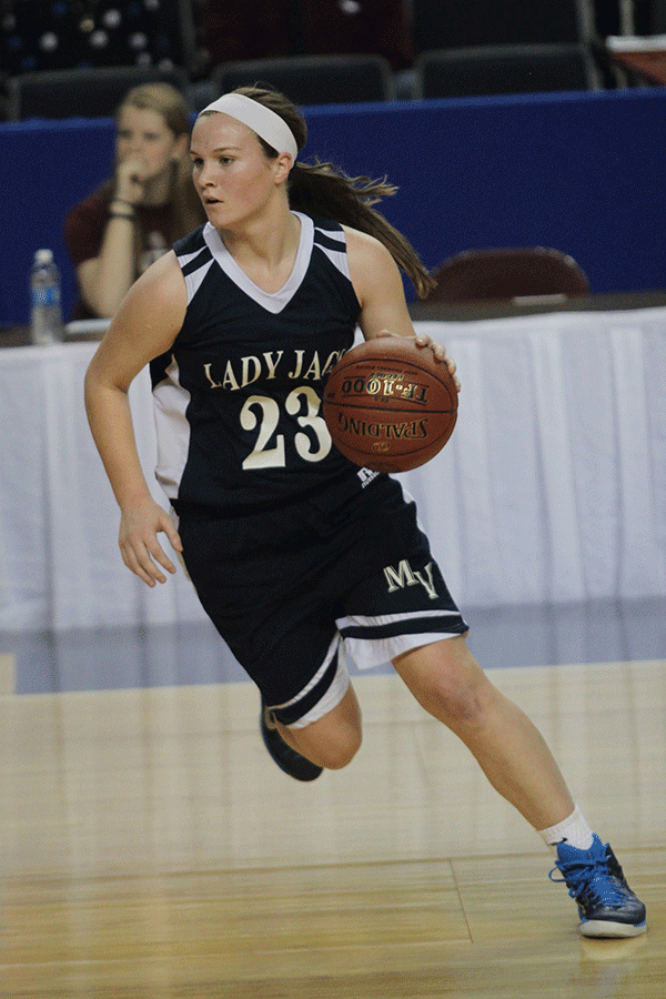 Freshman Claire Kaifes turns towards the basket.