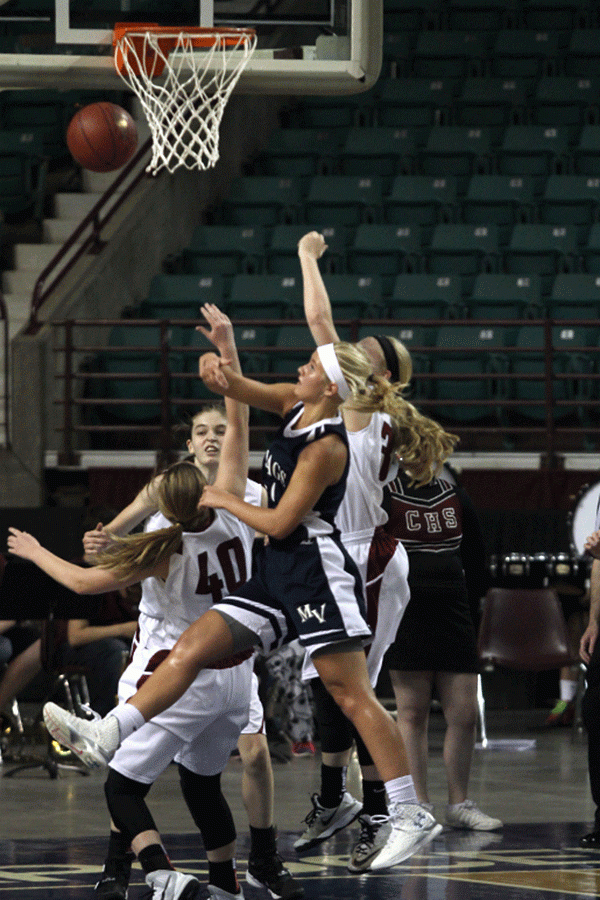 Junior Courtney Carlson blocks the ball. 