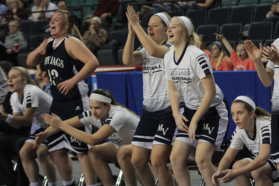 The Lady Jags cheer on their teammates. 