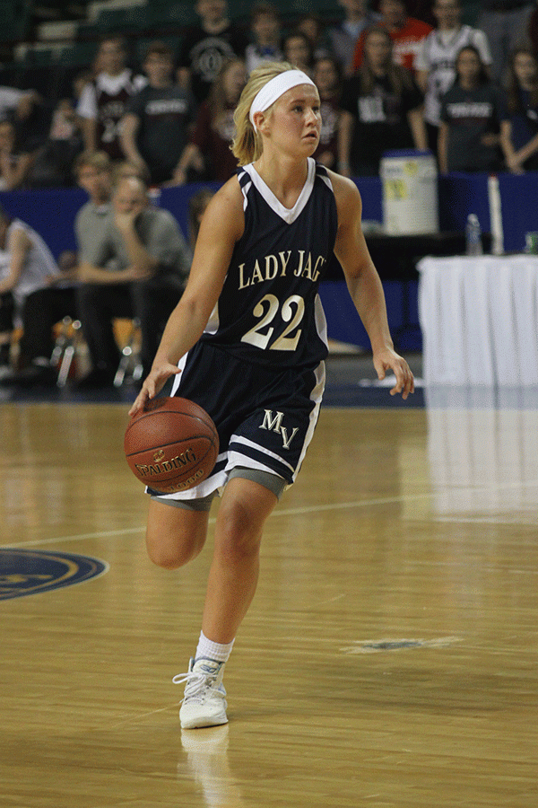 Junior Courtney Carlson runs down the court. 